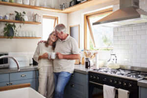 couple hugging in kitchen